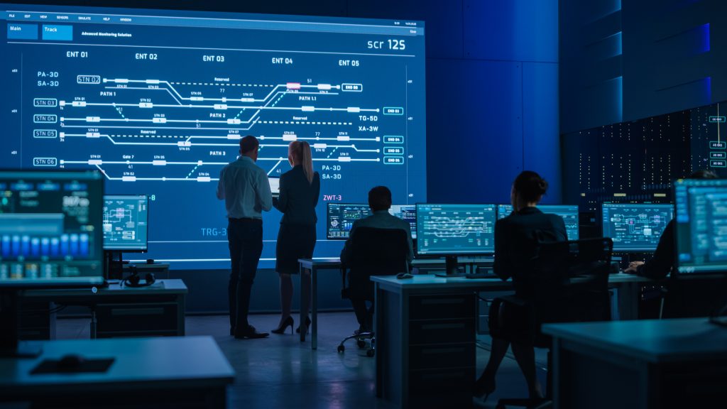 general control room image with man and woman
