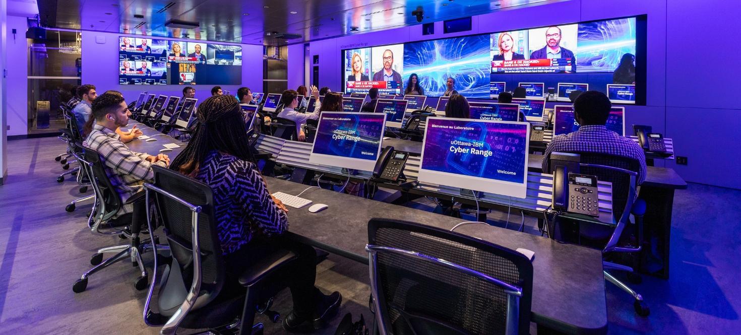 Students working in an IBM Cyber Range training environment